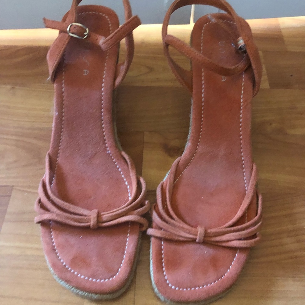 Orange suede wedges.